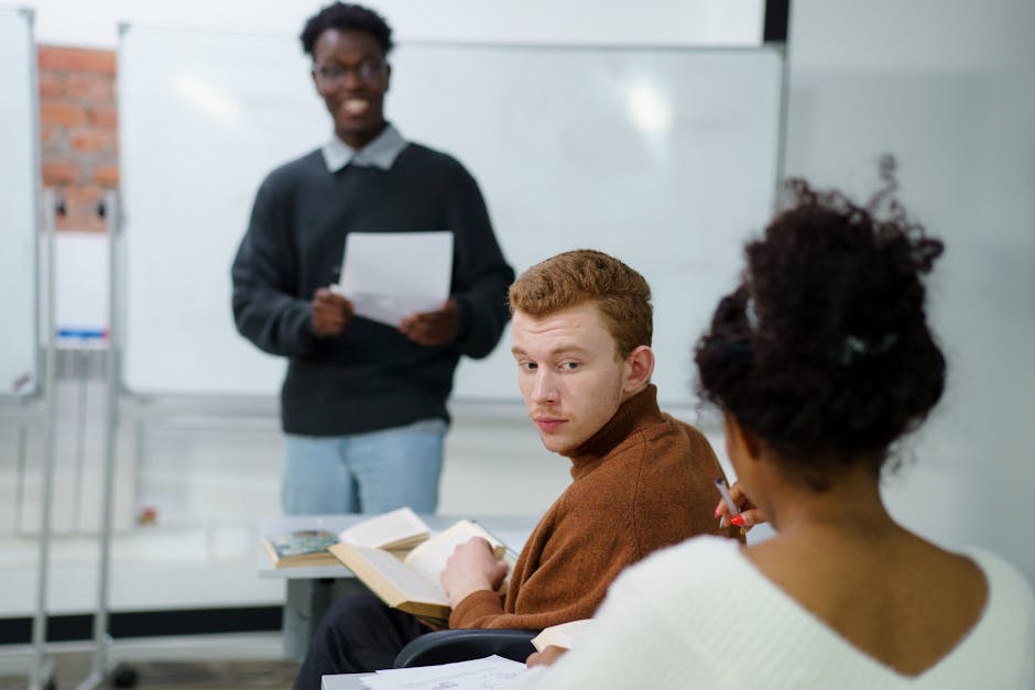 Students actively participating in a classroom discussion, fostering teamwork and learning.