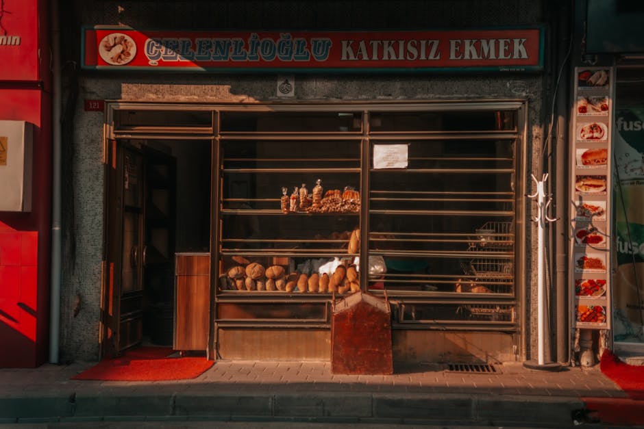 An inviting bakery storefront showcasing a variety of freshly baked breads and pastries.