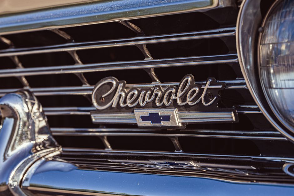 Detailed view of the iconic Chevrolet grille and emblem on a vintage 1966 Caprice.