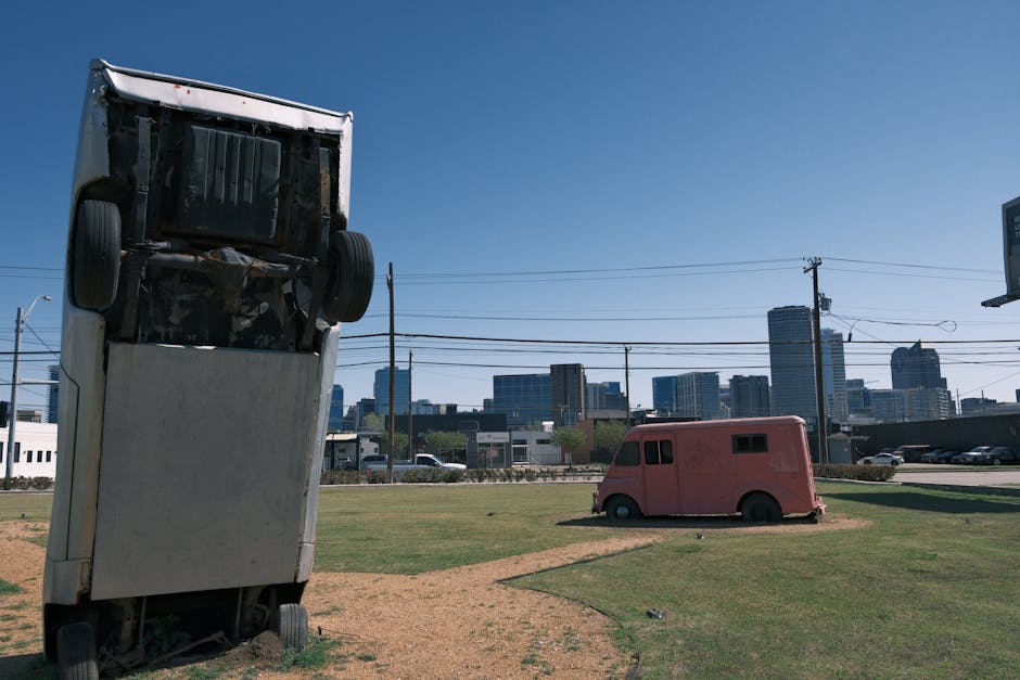 Unique artistic installation of trucks with urban skyline, showcasing creativity and modern urban art.